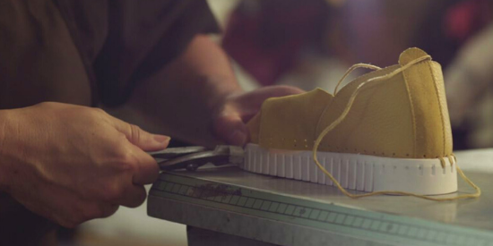 man sewing a pair of bendys